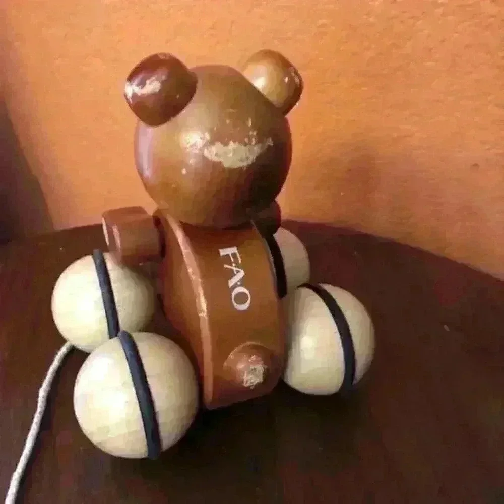 FAO Schwarz brown wooden bear rolling toy baby